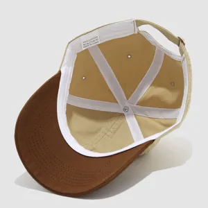 Kids baseball cap interior detail view, khaki crown and brown brim, cotton fabric lining.