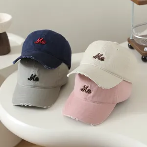 Children's baseball cap with cute Me letter embroidery, distressed brim design, casual style for kids.