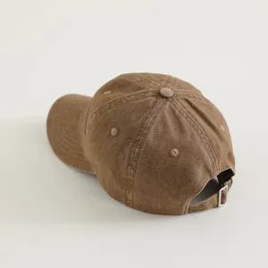 Detail view of the washed cotton kids baseball cap showing the adjustable metal buckle and stitching.