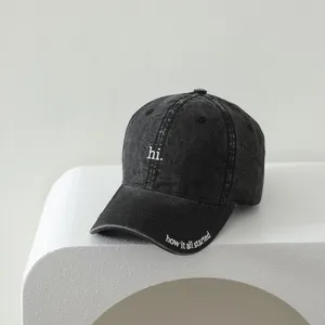 Distressed black washed kids baseball cap with cute white embroidery letters, casual style.