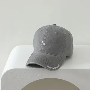 Kids washed baseball cap in dark grey featuring cute front embroidery and casual daily style.