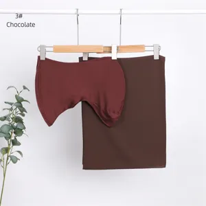 Detail shot of the chocolate modal inner cap and matching chiffon scarf hanging neatly.