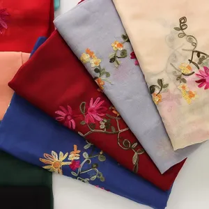 Detailed view of lightweight cotton linen embroidered floral scarf shawl multi-color.