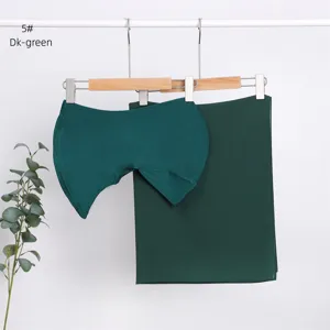 Dark green modal inner cap and chiffon scarf detail view, soft fabric texture and solid color.