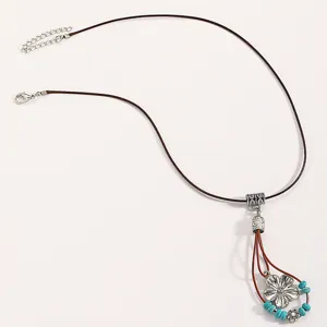 Vintage boho leather cord necklace with silver flower pendant and turquoise beads for women.
