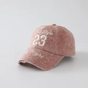 Vintage washed pink baseball cap with chic style 23 and bright embroidery for casual wear.