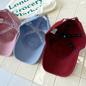 Detailed interior view of kids baseball caps showing quality lining, adjustable strap and multi colors