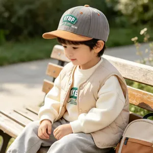 Kids baseball cap with grey crown, brown flat brim, and embroidered letters for autumn styling.