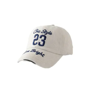 Vintage washed cotton baseball cap with stylish blue embroidered letters for daily outdoor wear.