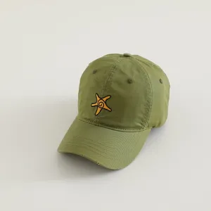 Detailed close-up of olive green kids baseball cap with cute yellow starfish embroidery.