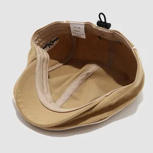 Khaki unstructured cap detail shot featuring an adjustable drawstring and interior label.