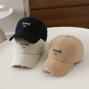 Casual distressed baseball cap with cute embroidered letters and smile design for daily wear.