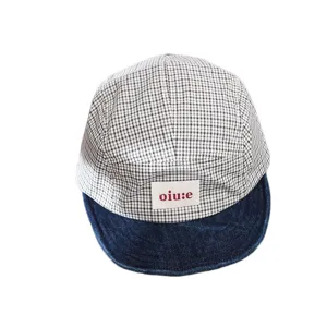 Kids checkered baseball cap with denim brim, stylish outdoor sun hat for boys and girls.