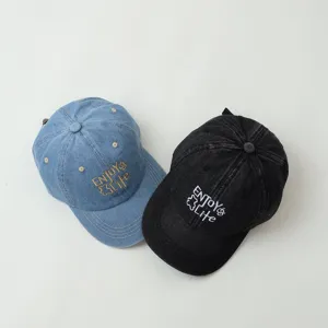 Classic denim baseball cap for kids, stylish embroidered design, comfortable everyday wear.