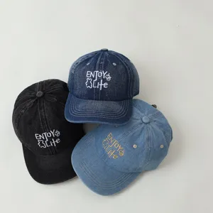 Detailed view of kids denim baseball cap with embroidered logo, casual style sun hat for daily wear.