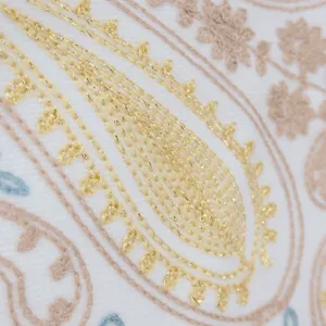Close-up of gold thread paisley embroidery on imitation cashmere shawl scarf detail
