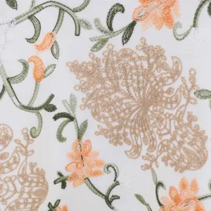 Detailed shot of ethnic embroidered cashmere-feel winter scarf shawl with floral motifs.