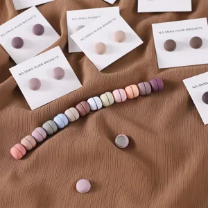 Round matte colorful magnetic hijab pins detail view, secure scarf clips and collar buttons.