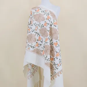 Detailed view of white imitation cashmere embroidered floral shawl scarf for winter warmth.