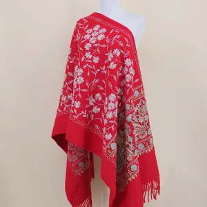Red thick cashmere-feel shawl with exquisite floral embroidery and fringe hemline for women.