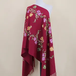 Burgundy cashmere-feel scarf with intricate floral vine embroidery and elegant fringe details.