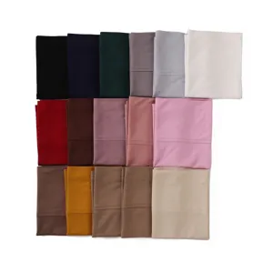 Detailed view of multiple solid color modal underscarf color swatches, soft fabric texture.