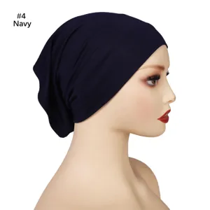Close-up detail of the solid color modal wide-brim undercap in navy blue, soft and stretchy.