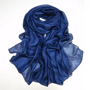Dark blue crinkled sheer scarf fabric detail, lightweight solid shawl close up display.