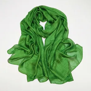 Green solid color scarf detail, soft texture and draping fabric, elegant look for daily wear.