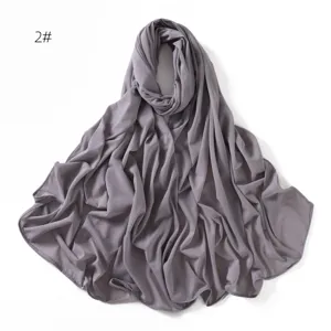Grey stretch jersey hijab detail, soft and breathable fabric closeup, plain scarf.