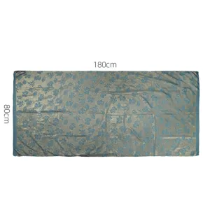 Detailed view of the crinkled metallic gold leaf pattern long scarf showing texture and size.