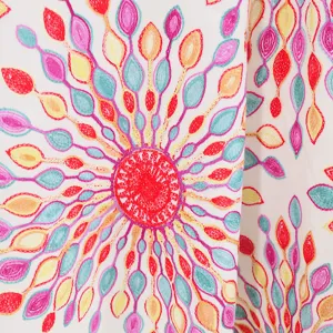 Close-up detail shot of ethnic style embroidered sunflower cashmere imitation scarf cape.