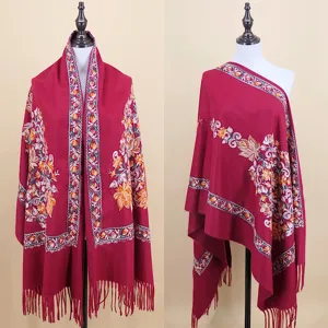 Detailed closeup of dark red imitation cashmere shawl featuring elegant floral embroidery.