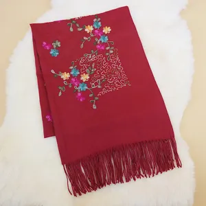 Women's red autumn winter imitation cashmere scarf with floral embroidery and tassel fringe.