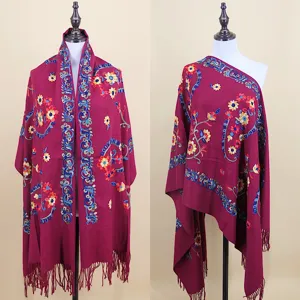 Detailed view of women's imitation cashmere embroidered paisley winter shawl and warm scarf.