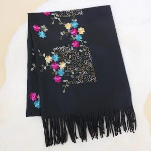 Black winter cashmere feel scarf with colorful floral embroidery and fringe detail main view