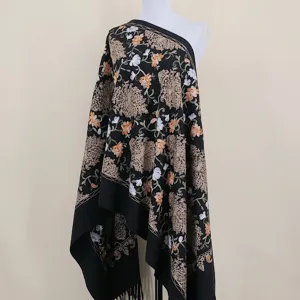 Detailed view of black cashmere-feel ethnic embroidered shawl, exquisite floral pattern scarf.