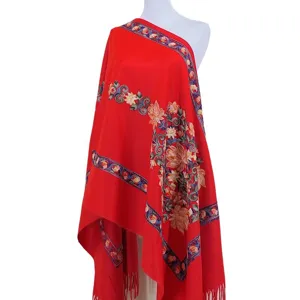 Red imitation cashmere shawl with ethnic floral embroidery and tassels, warm winter cloak.