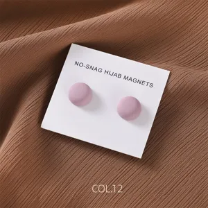 Detail shot of matte finish round hijab magnetic pins, minimalist design, 2-piece set.