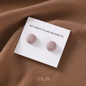 Matte finish pink magnetic hijab pins detail shot, showing smooth round button design and backing card.