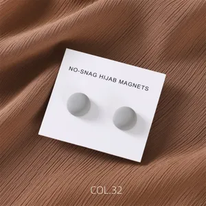 Grey matte round magnetic hijab pins detail view, secure scarf and shawl accessories set.