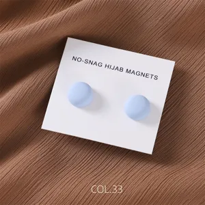 Matte magnetic hijab pins round metal scarf clips in light blue set of two detail shot.