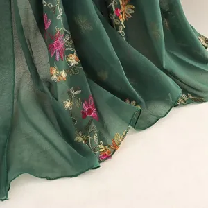 Close-up detail of green cotton linen embroidered scarf women floral ethnic shawl sunscreen gauze.