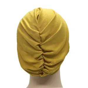 Detail view of the yellow modal stretchy inner cap showing back ruching and texture.
