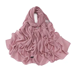 Elegant pink chiffon hijab scarf with sparkling rhinestones and floral decoration for women.