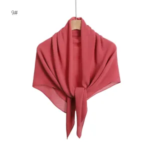 Detailed view of rose red pleated chiffon square scarf with shimmering silver accents.