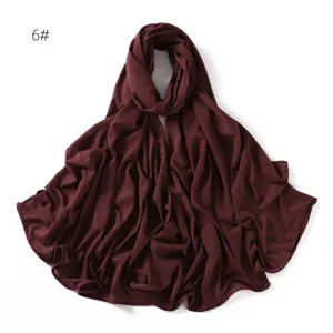 Detailed view of a soft burgundy stretch jersey hijab, showing smooth texture and drape.
