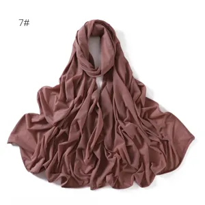 Close-up detail of the soft elastic jersey hijab scarf fabric texture and pleats.