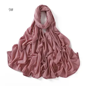 Detail view of the soft stretchy plain jersey hijab scarf in mauve color, comfortable and neat.