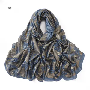 Detailed view of breathable crinkled gold foil leaf cotton linen scarf shawl for women.